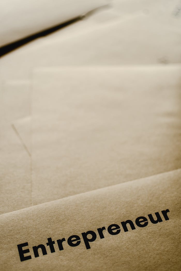 gallery-2 A close-up of brown paper with the word 'entrepreneur,' inspiring business and creativity.